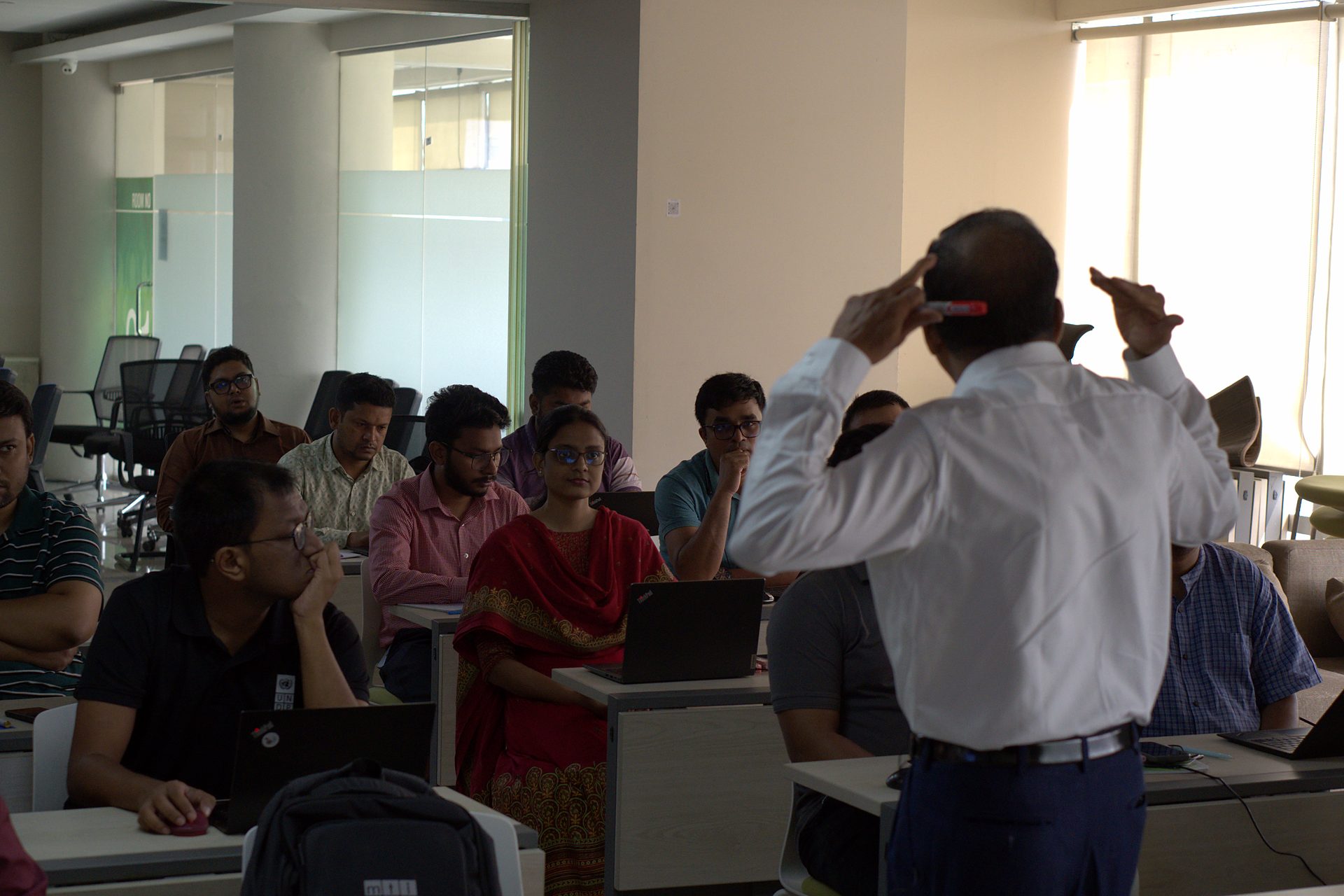 Trainer gesturing to the cohort