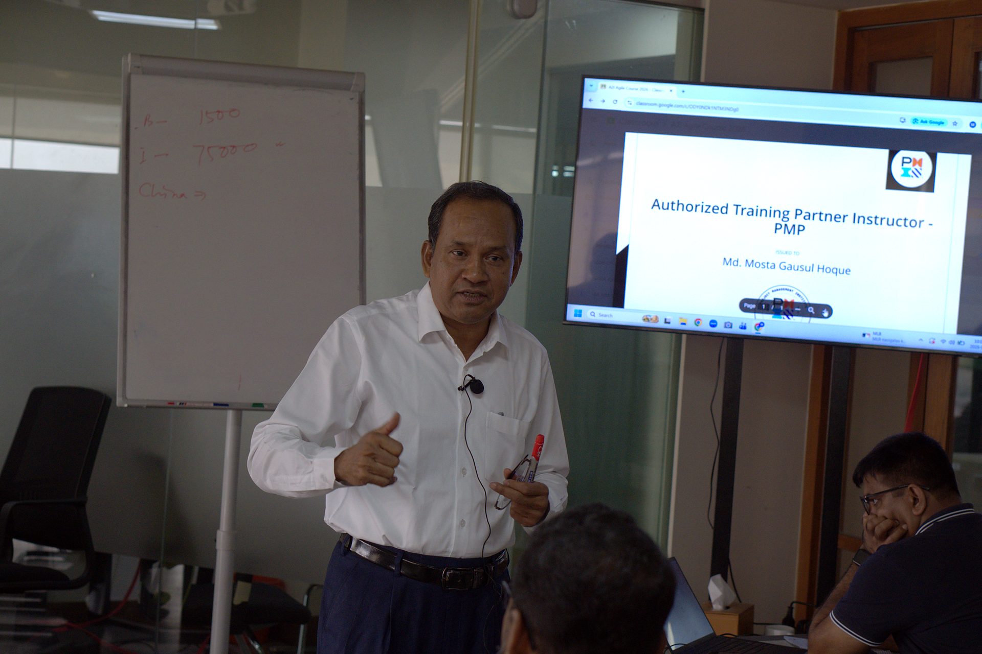 Md. Mosta Gausul Hoque, PMP, presenting beside his PMI Authorized Training Partner Instructor credential on screen