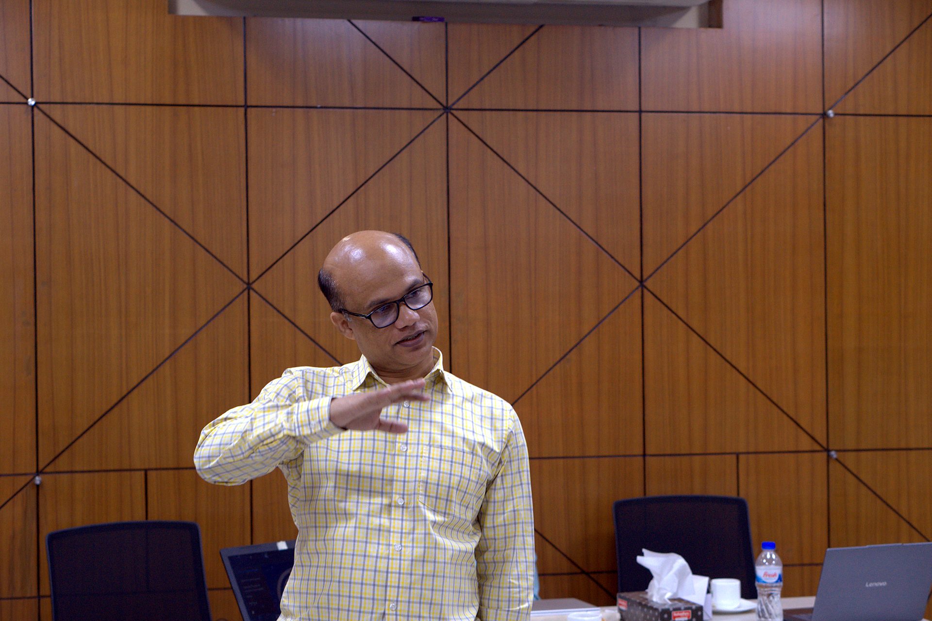 Trainer explaining a concept with hand gestures