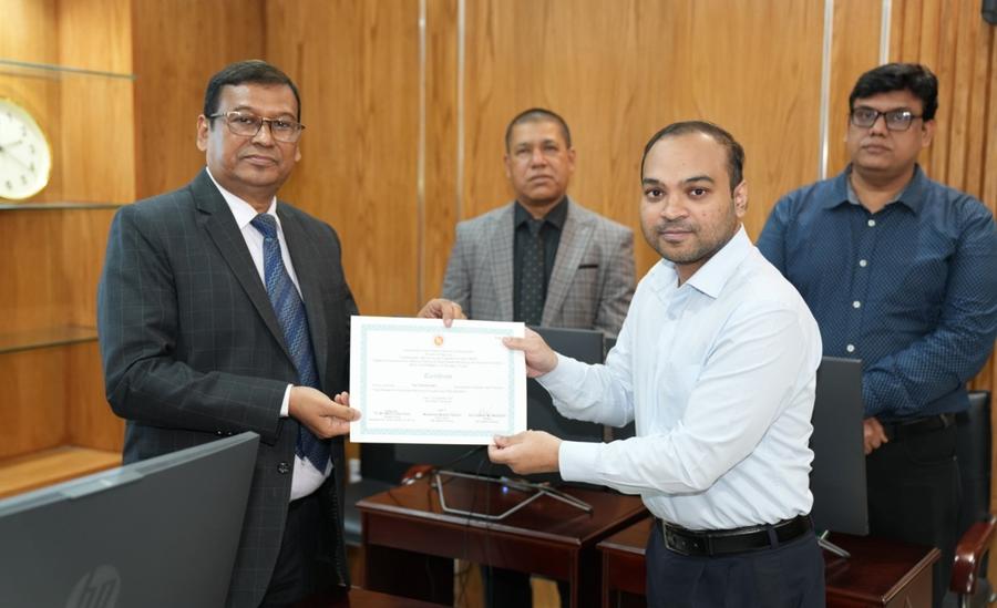 A participant receiving a certificate from the Secretary