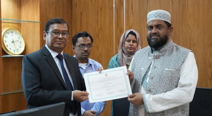 A participant receiving a certificate from the Secretary