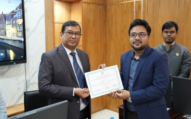 A participant receiving a certificate from the Secretary