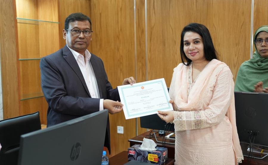 A participant receiving a certificate from the Secretary