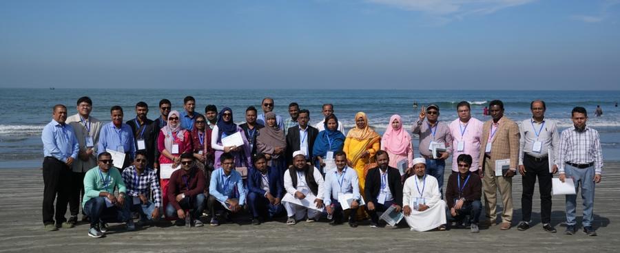 Group photo of the IMED training participants on the beach of St. Martin's Island