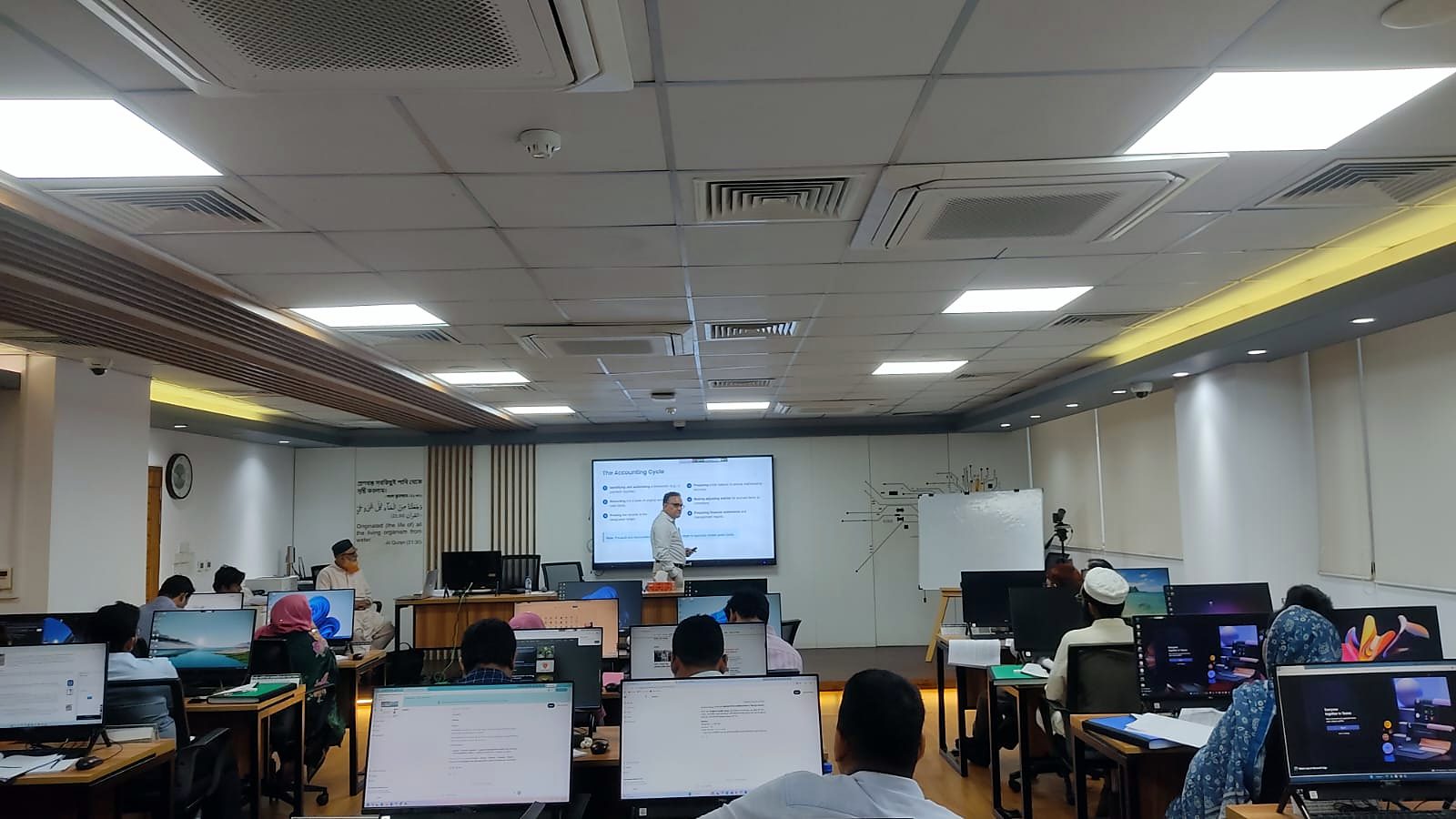 Wide view of participants seated at their workstations in the Central ICT Lab