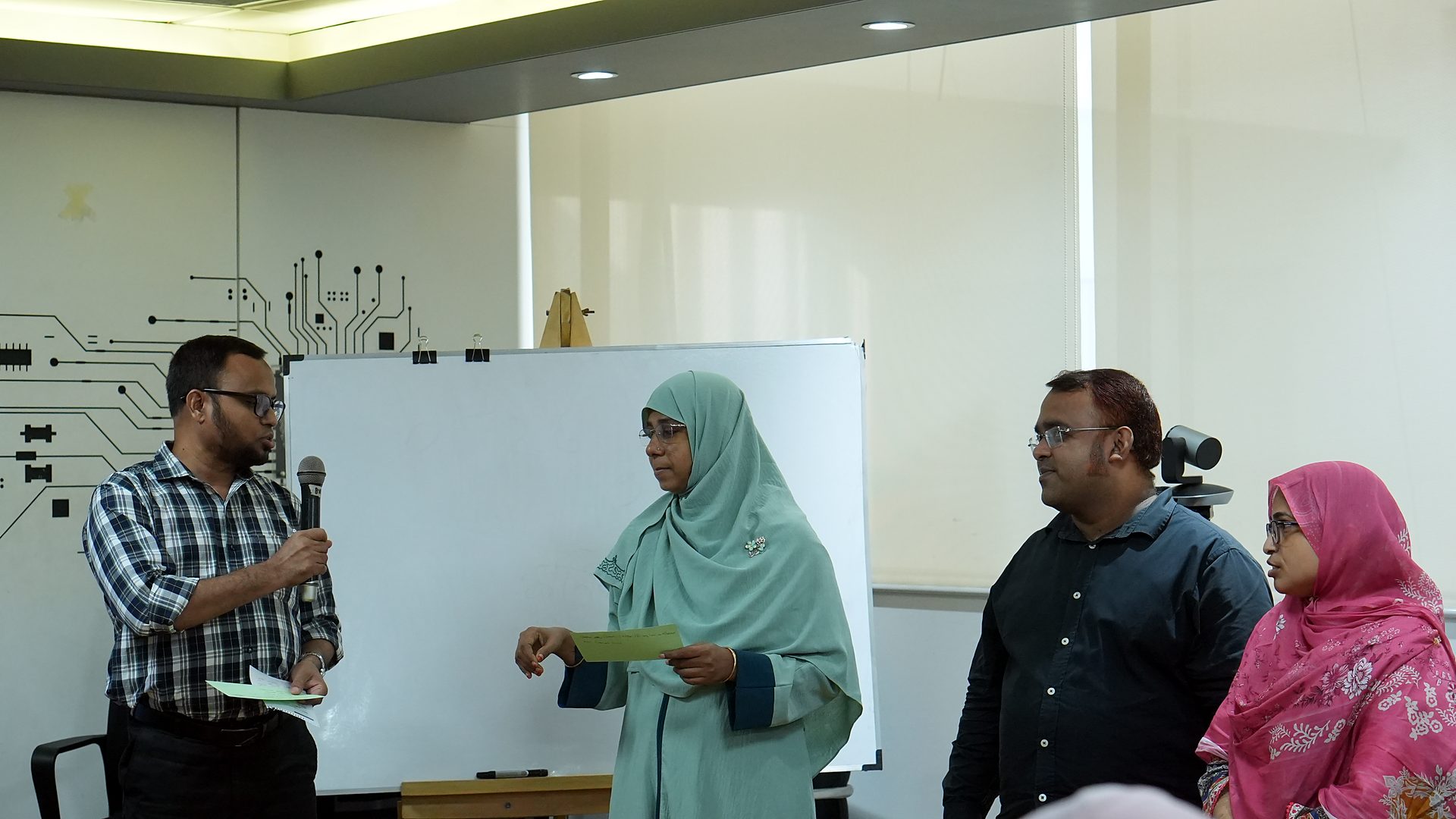 Participants presenting at the front of the lab
