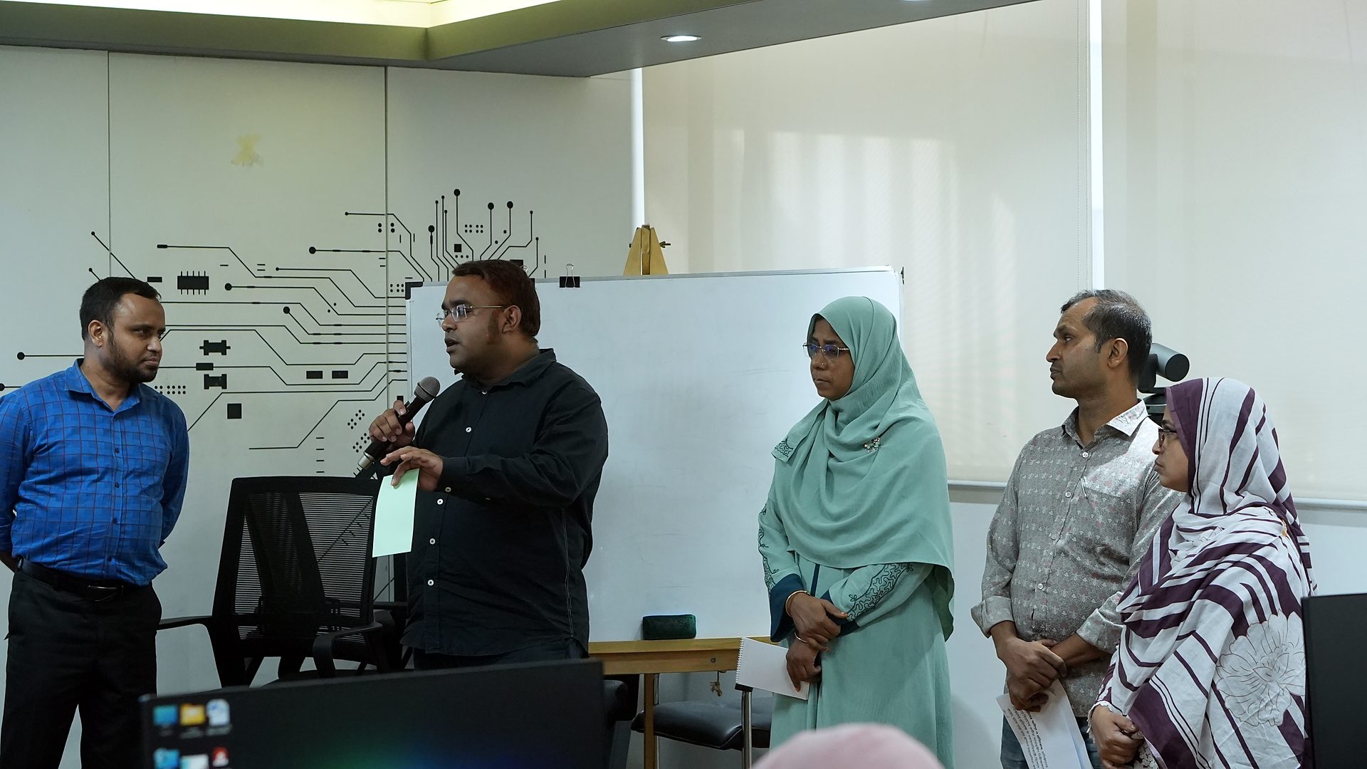 Team presenting at the whiteboard