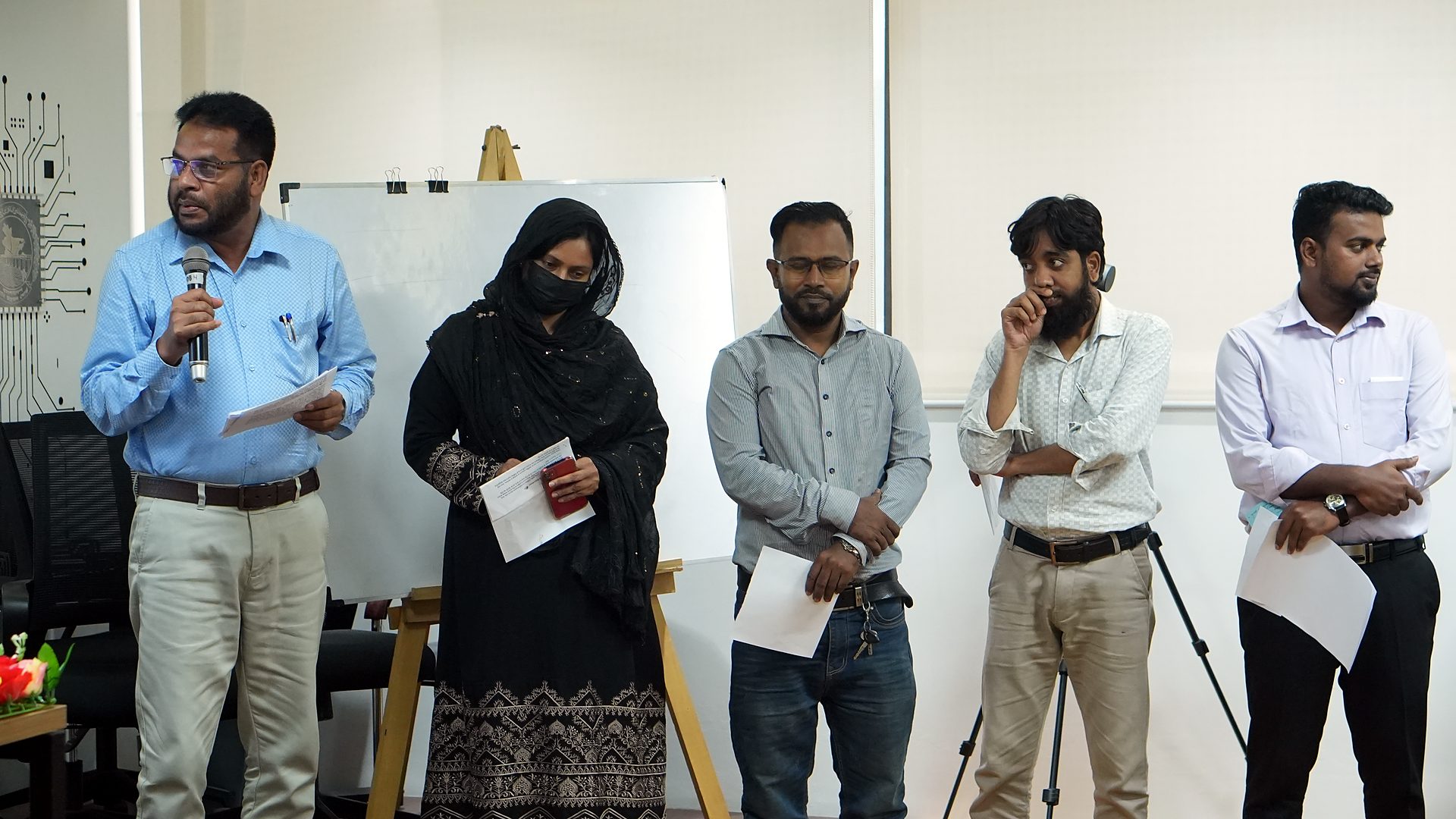 Team standing to present