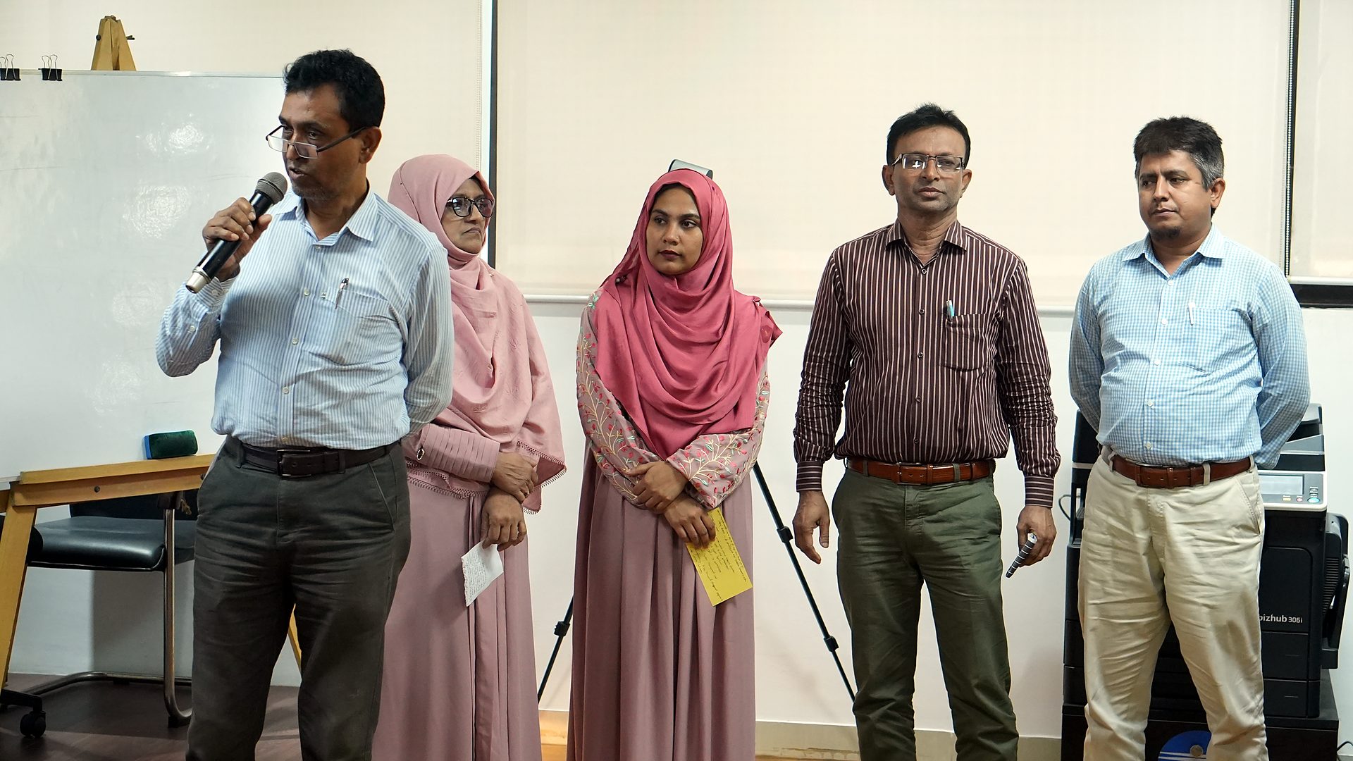 Second participant team presenting at the front of the lab