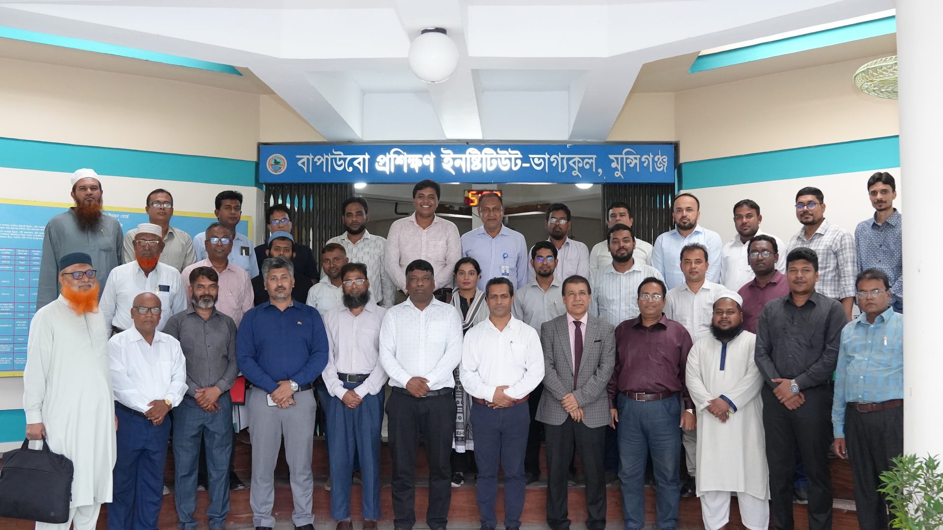 Group photograph of the IWRM Batch 1 cohort inside the training hall
