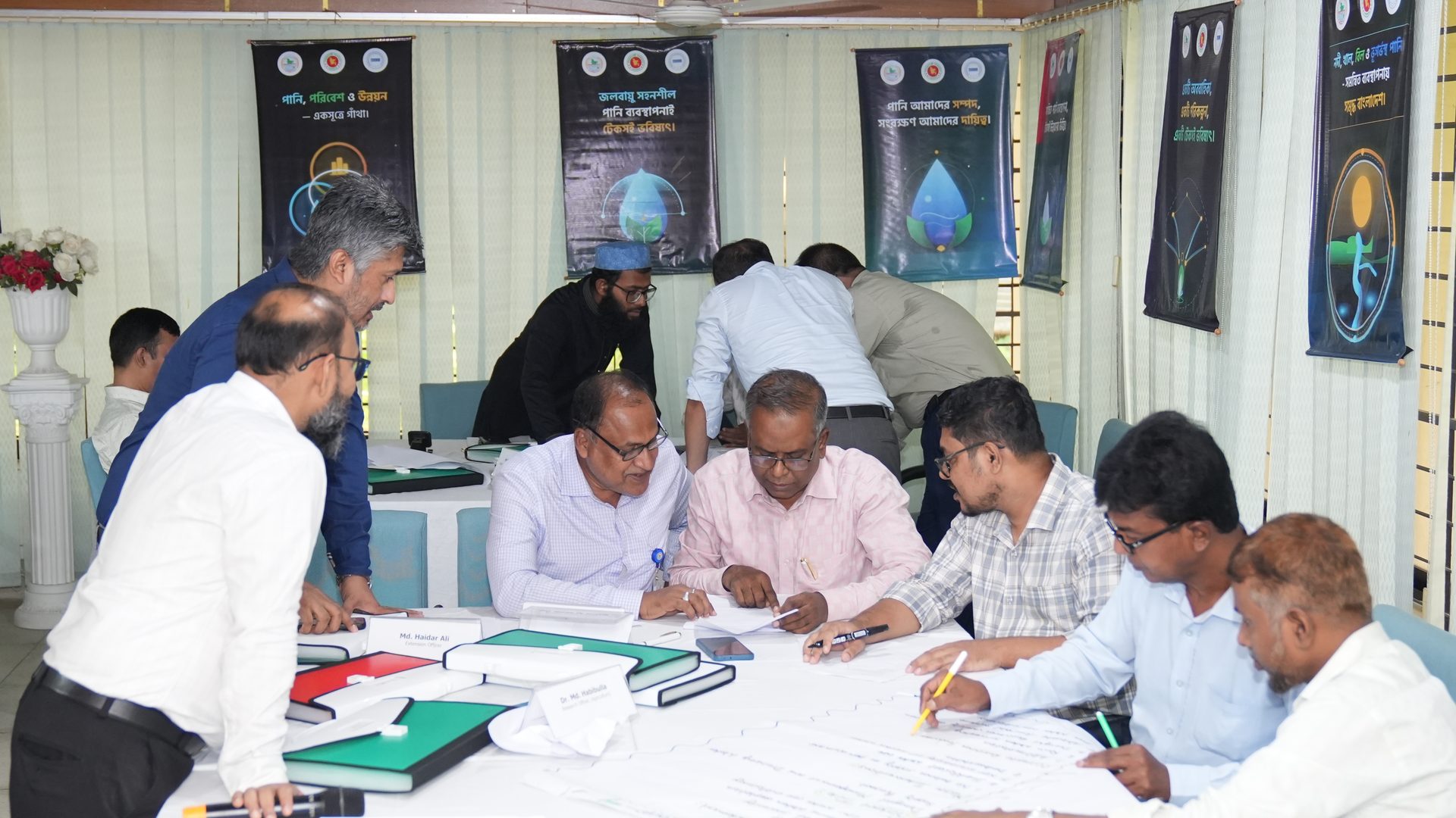 Participants working in small groups on the IWRM case study