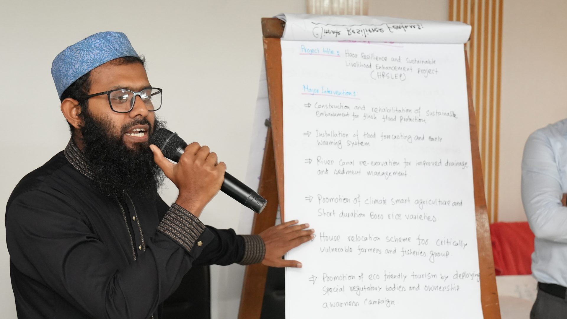 A participant group presenting their poster on IWRM-based project planning