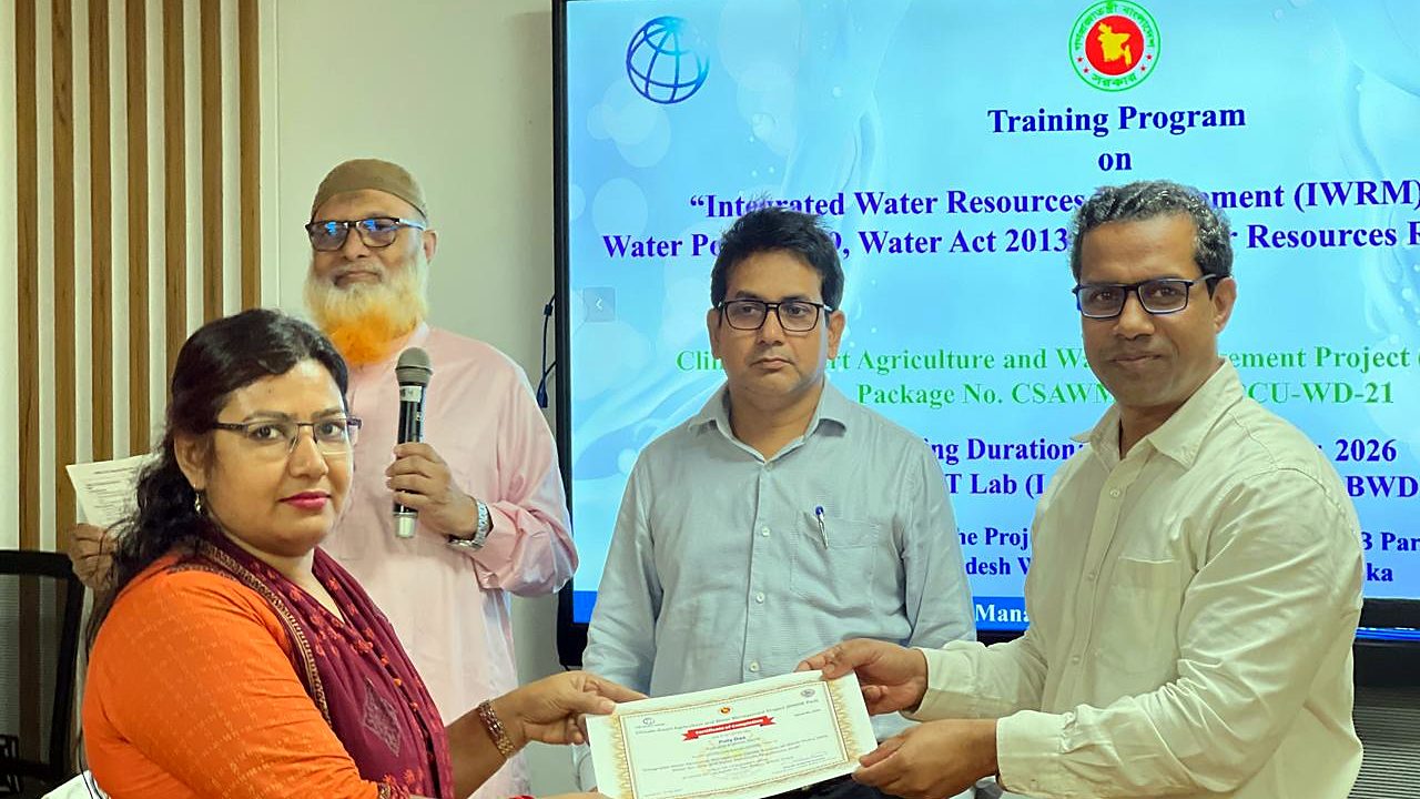 Participant receiving the IWRM course certificate