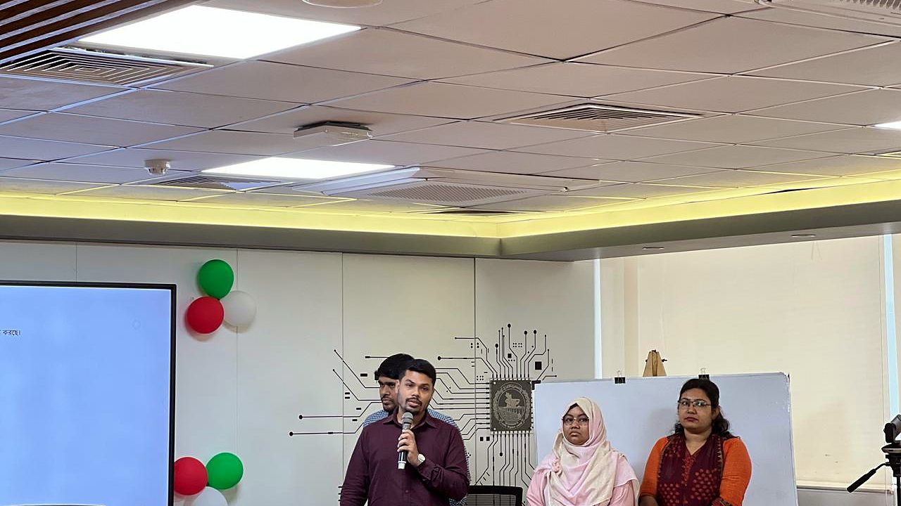 Participant group presenting at the front of the lab