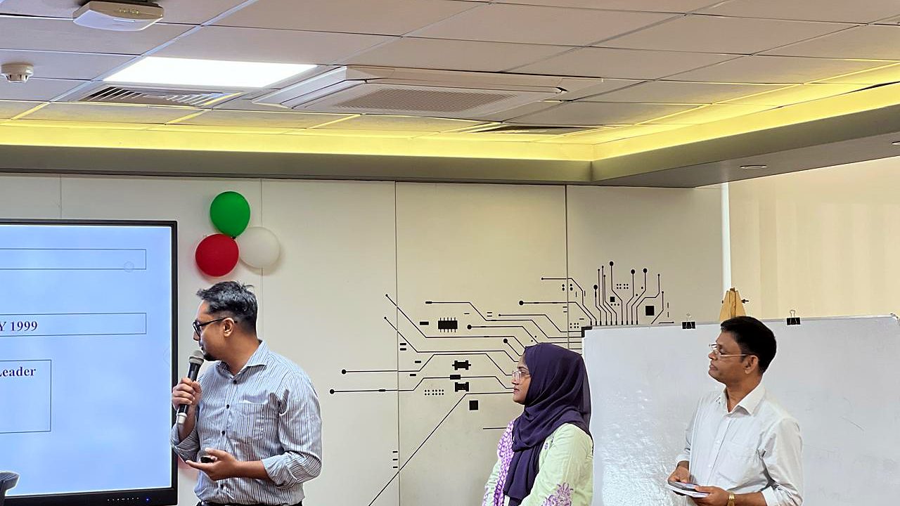 Participant presenting beside the screen