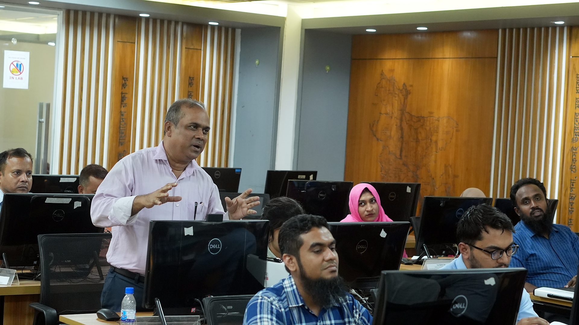 Resource person speaking among the participants