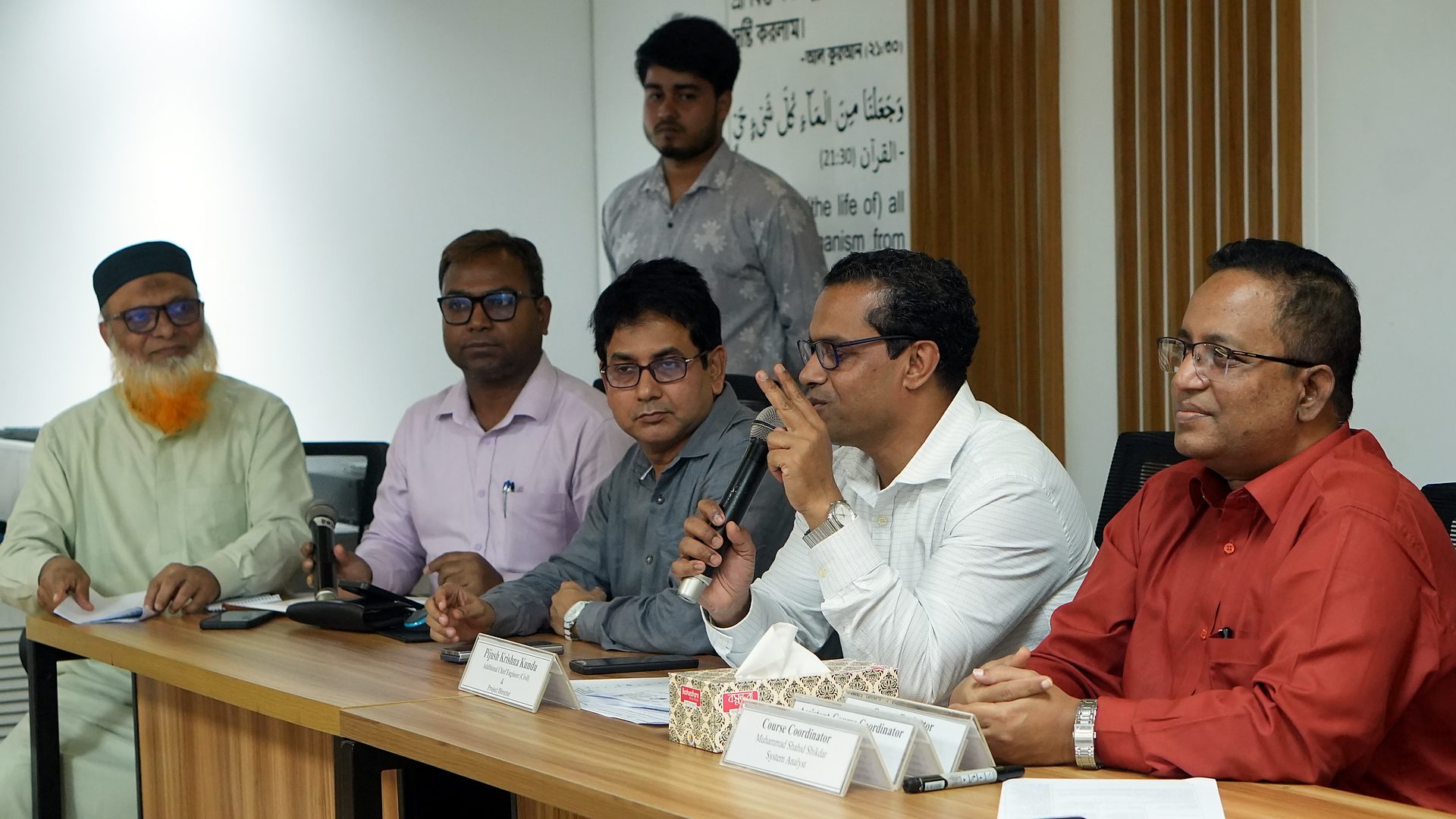 Review panel at the dais listening to a group presentation