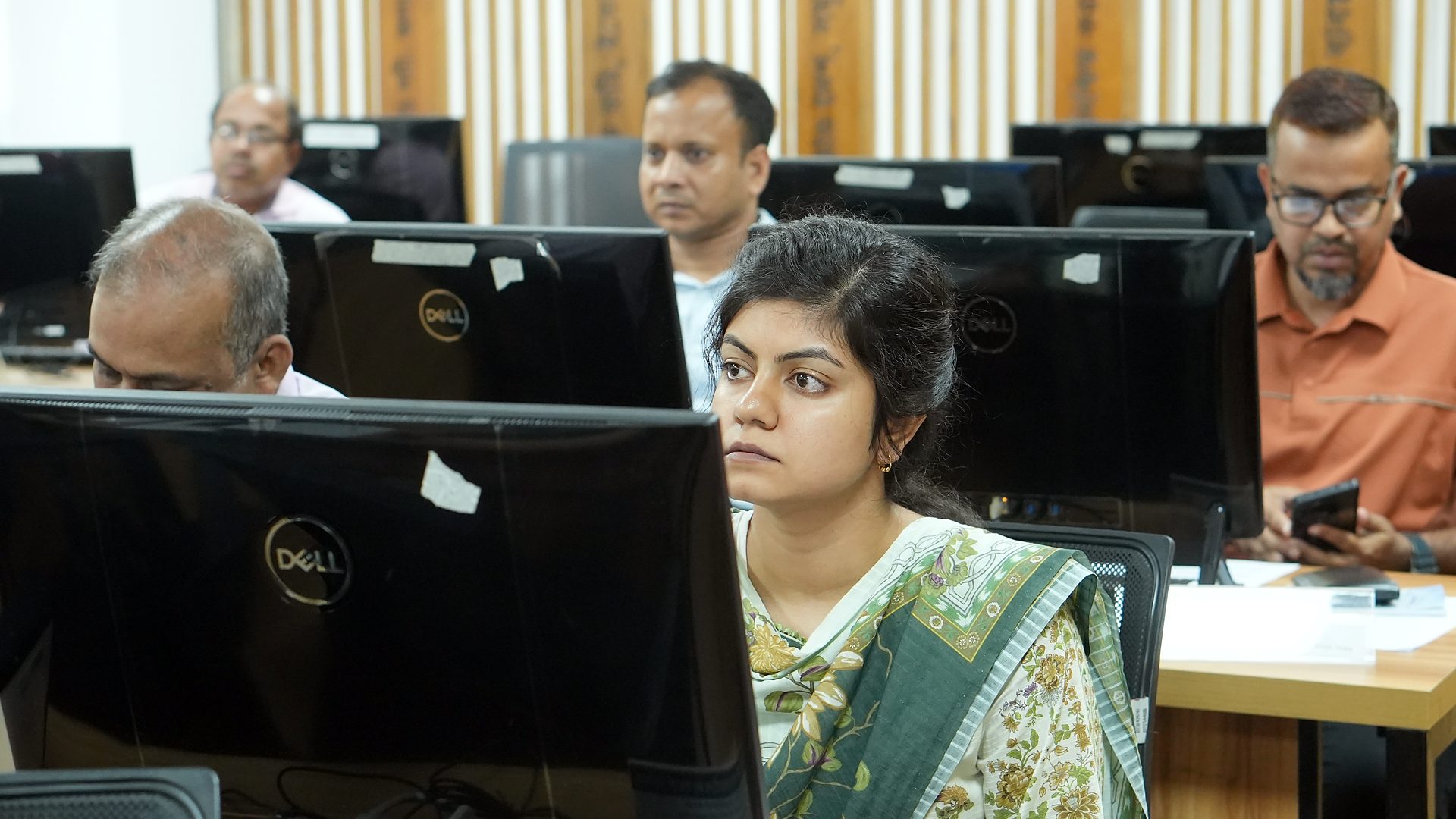 Participant following the session at her workstation