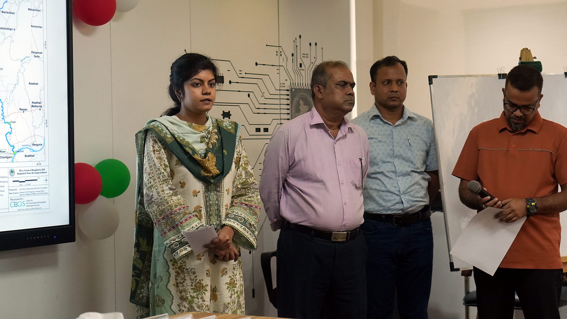 Group standing at the front of the lab to present