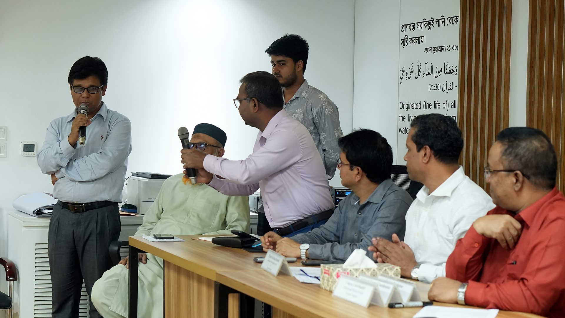 Review panel members discussing a presentation