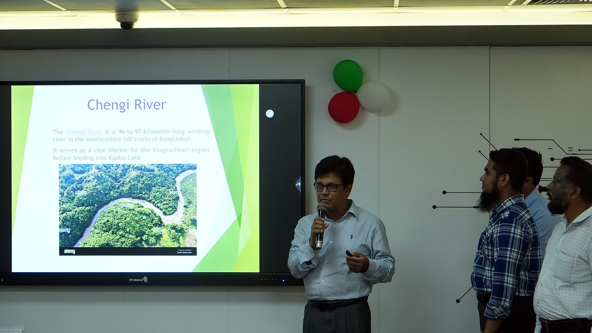 The Chengi River team presenting at the front of the lab