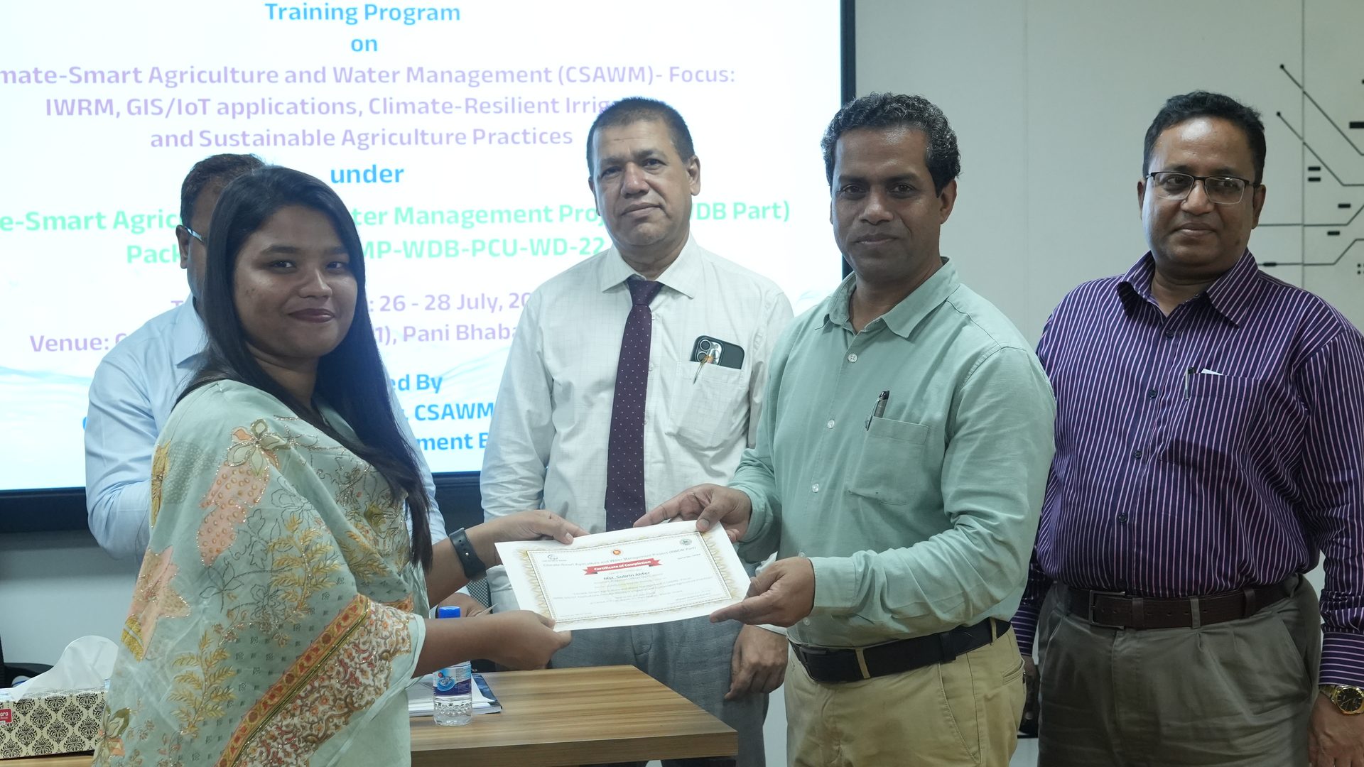 Certificate handover near the close of the ceremony
