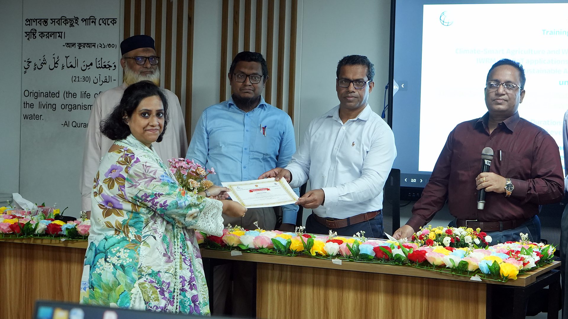 Participant receiving the CSAWM course certificate