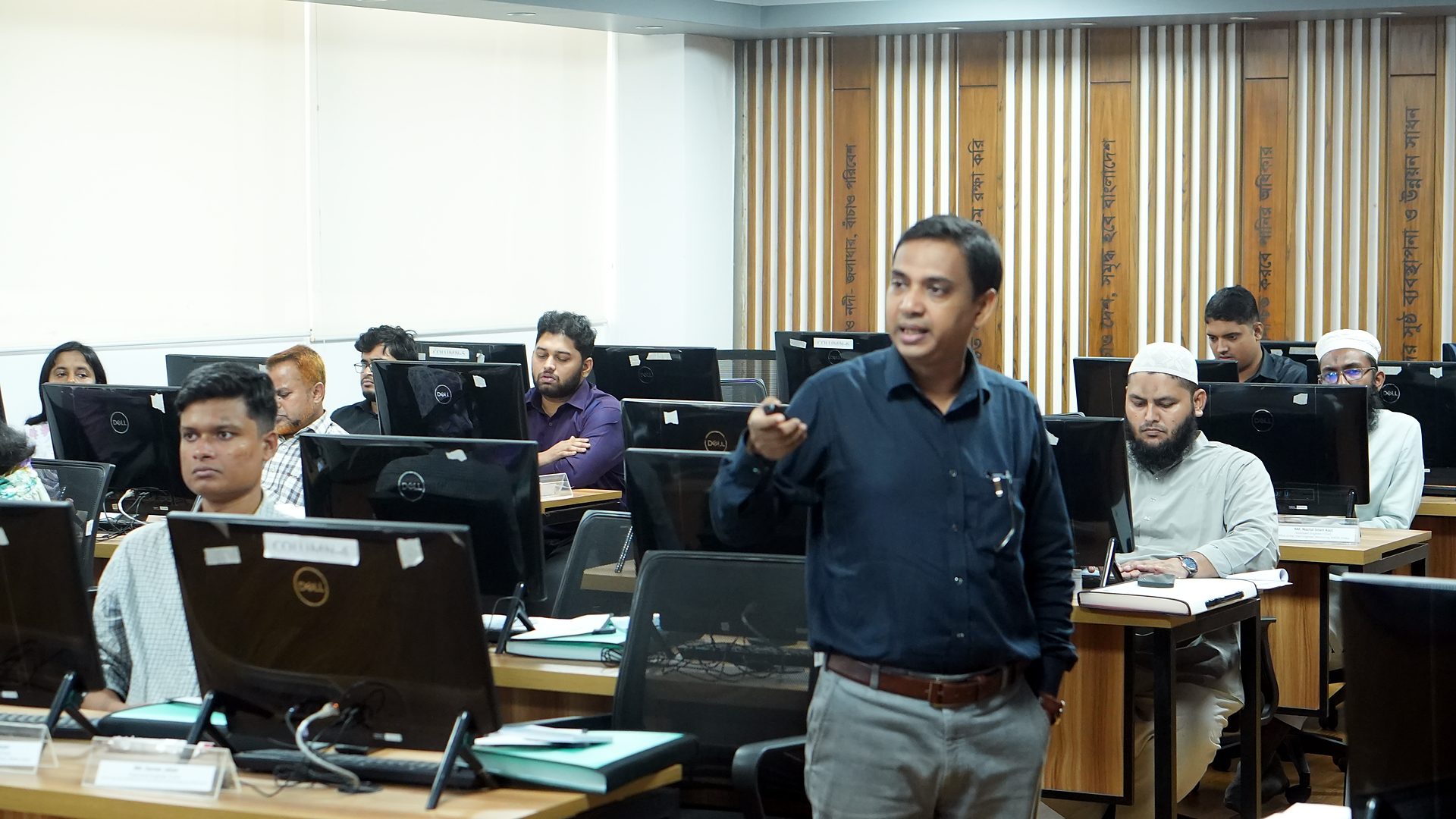 Resource person speaking to participants