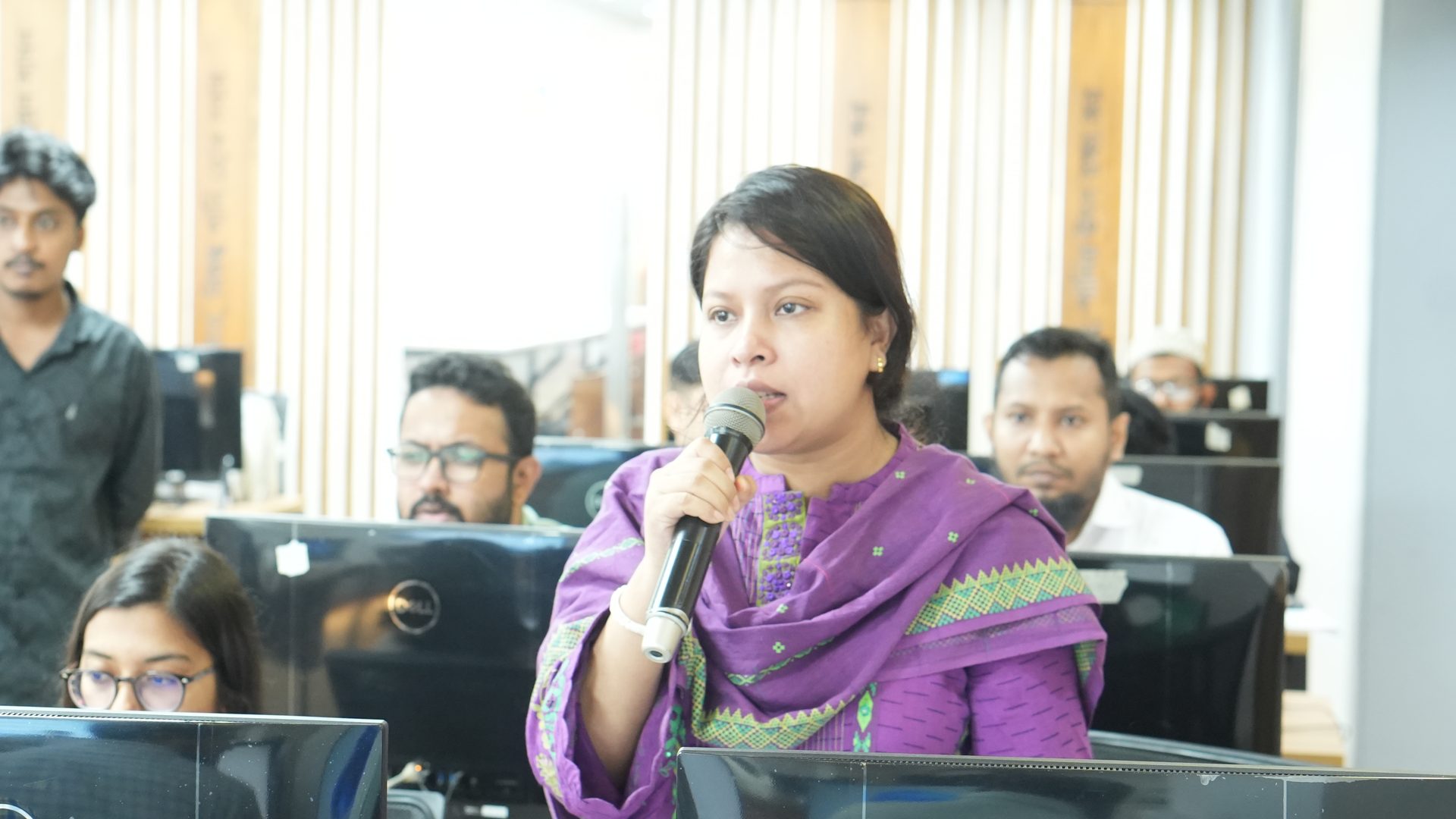 Participant introducing themselves at the opening session