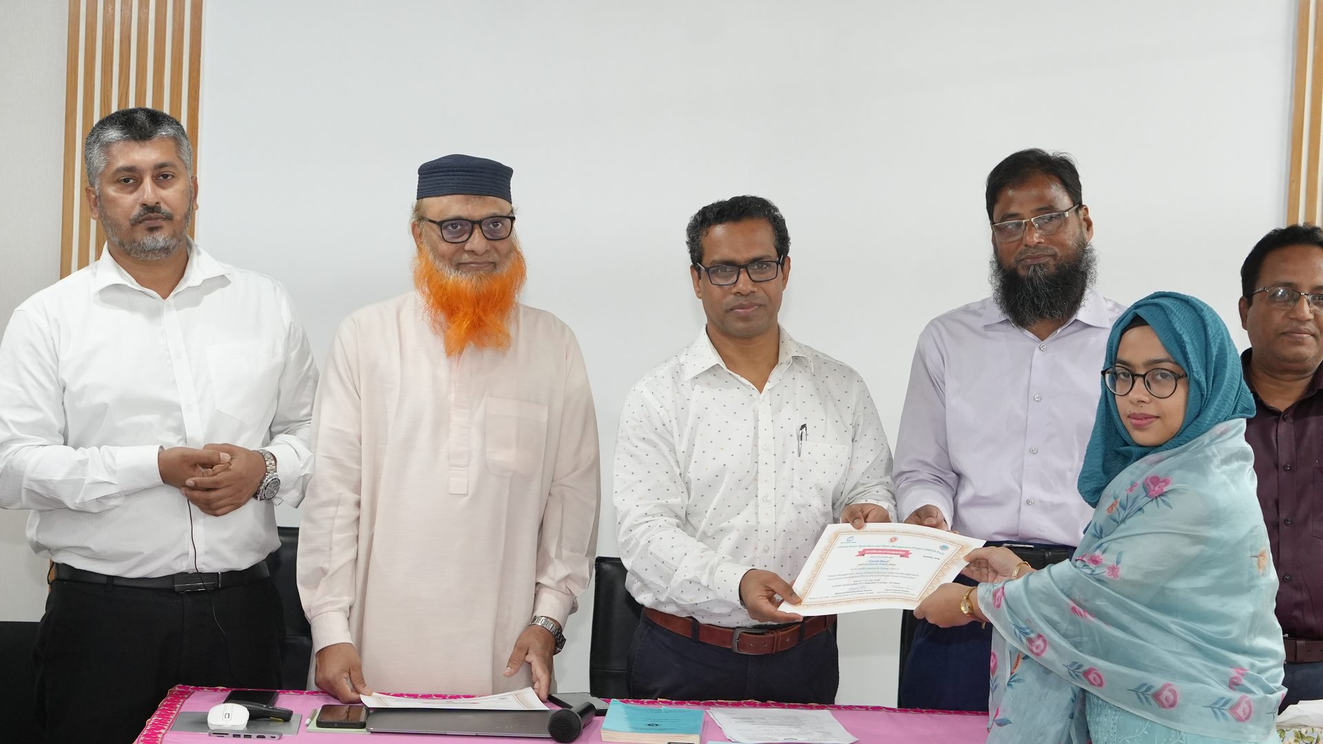 Participant receiving their course certificate