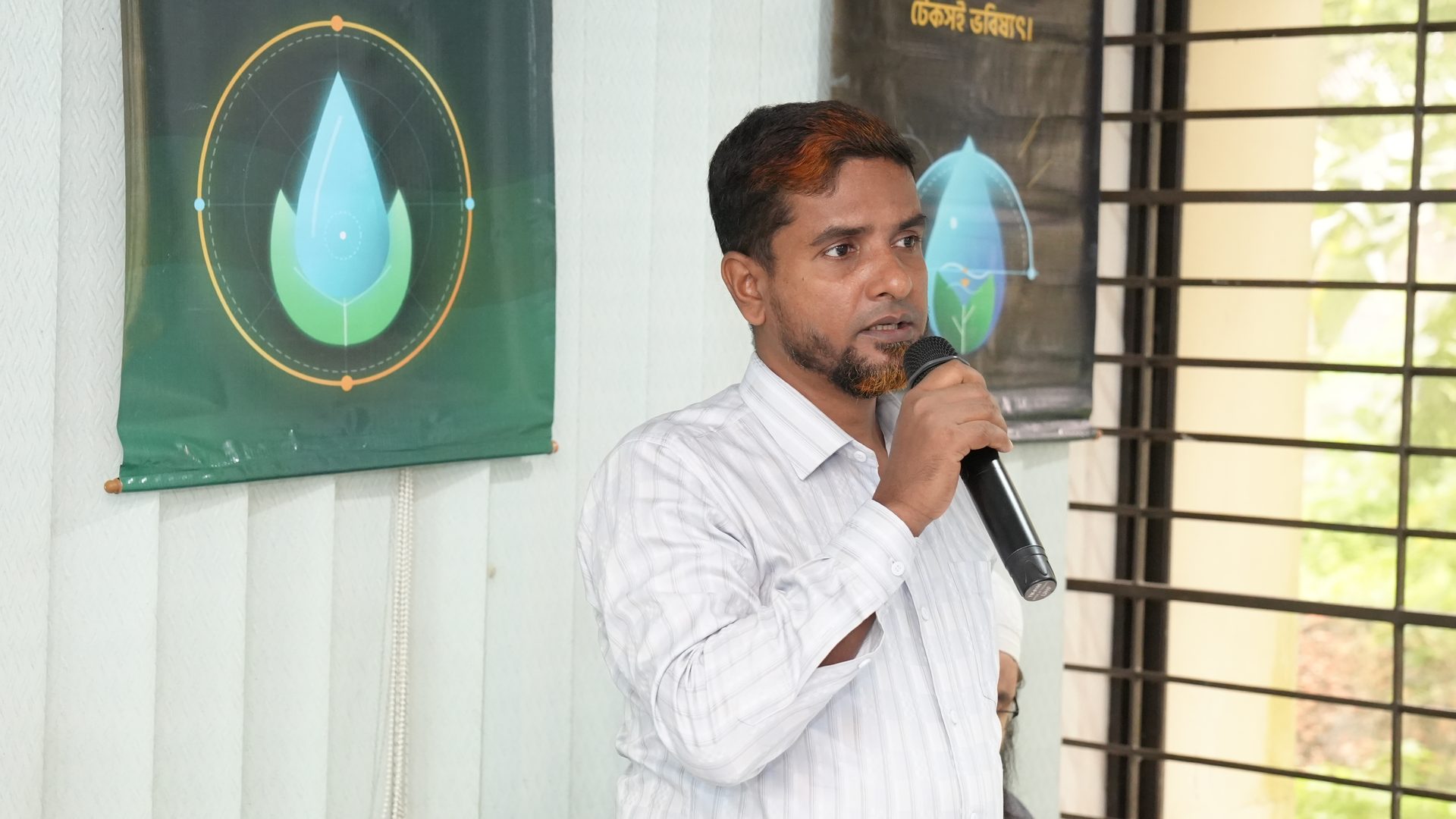 A participant speaking during the introduction round