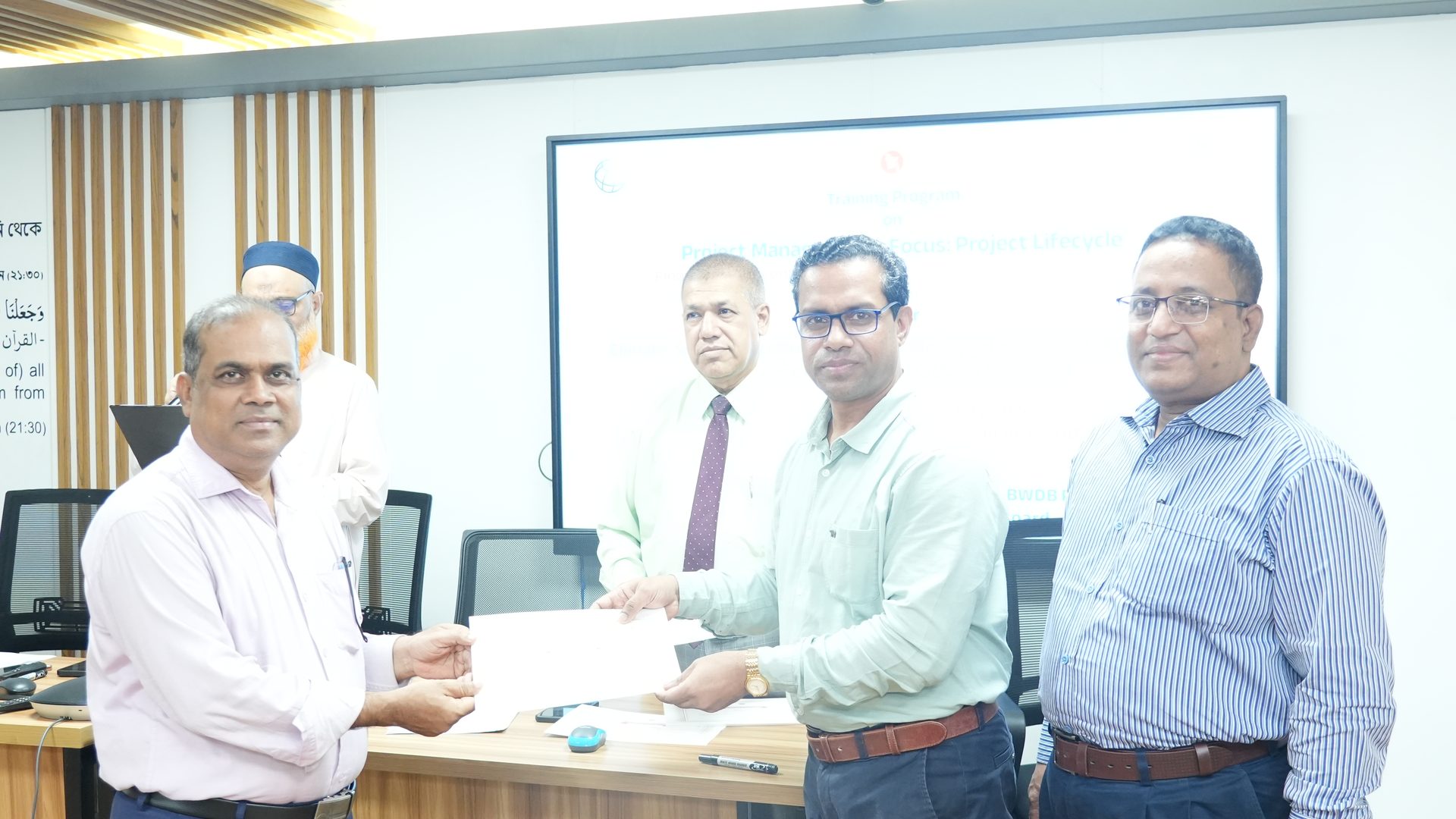 Participant receiving their course certificate