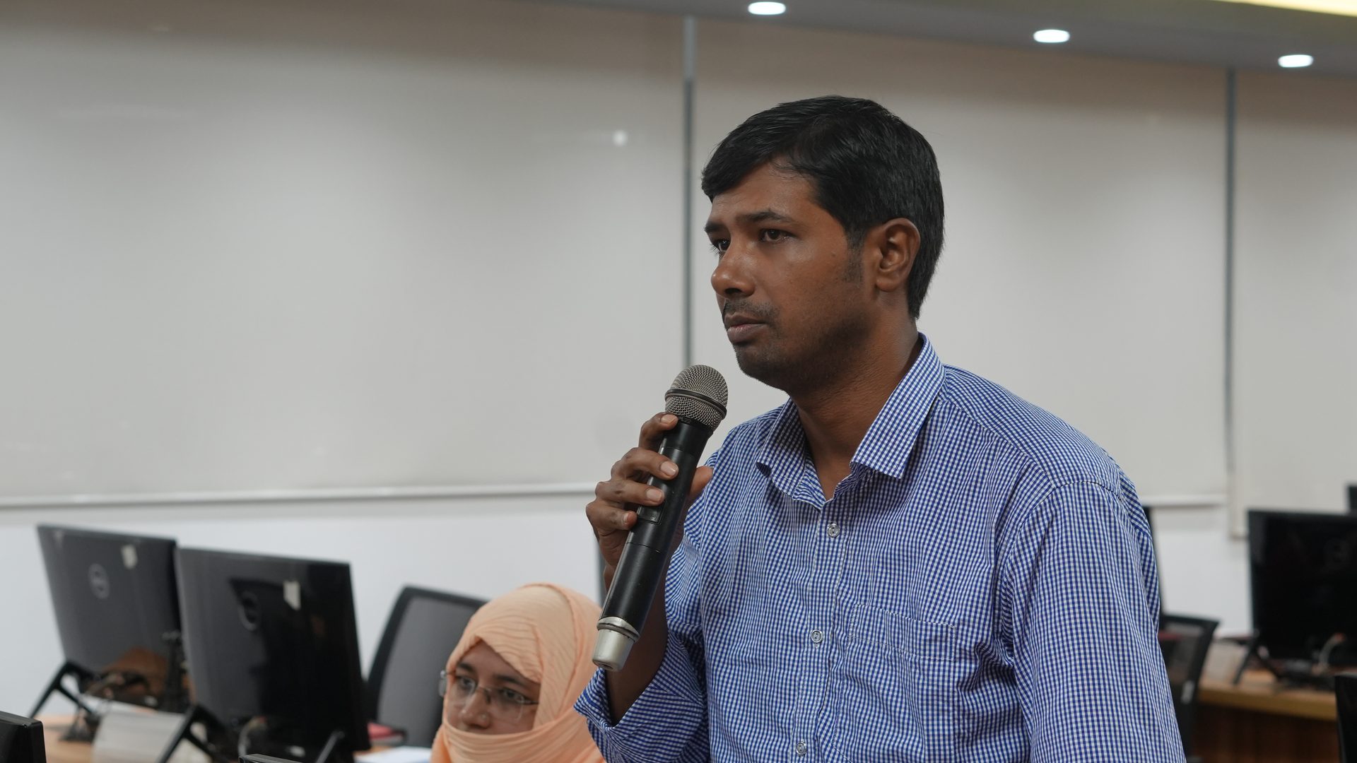 Participant introducing themselves at the opening session