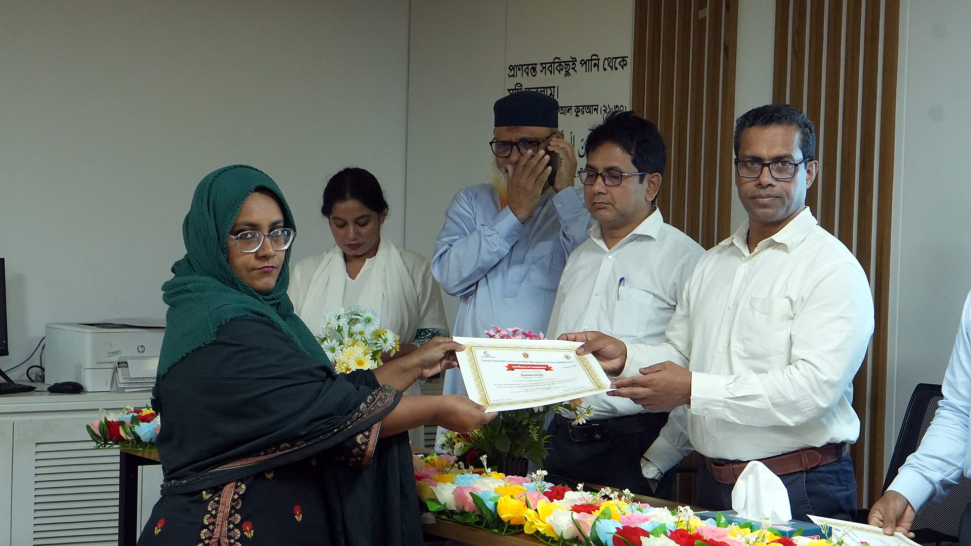 Participant receiving the Project Management course certificate