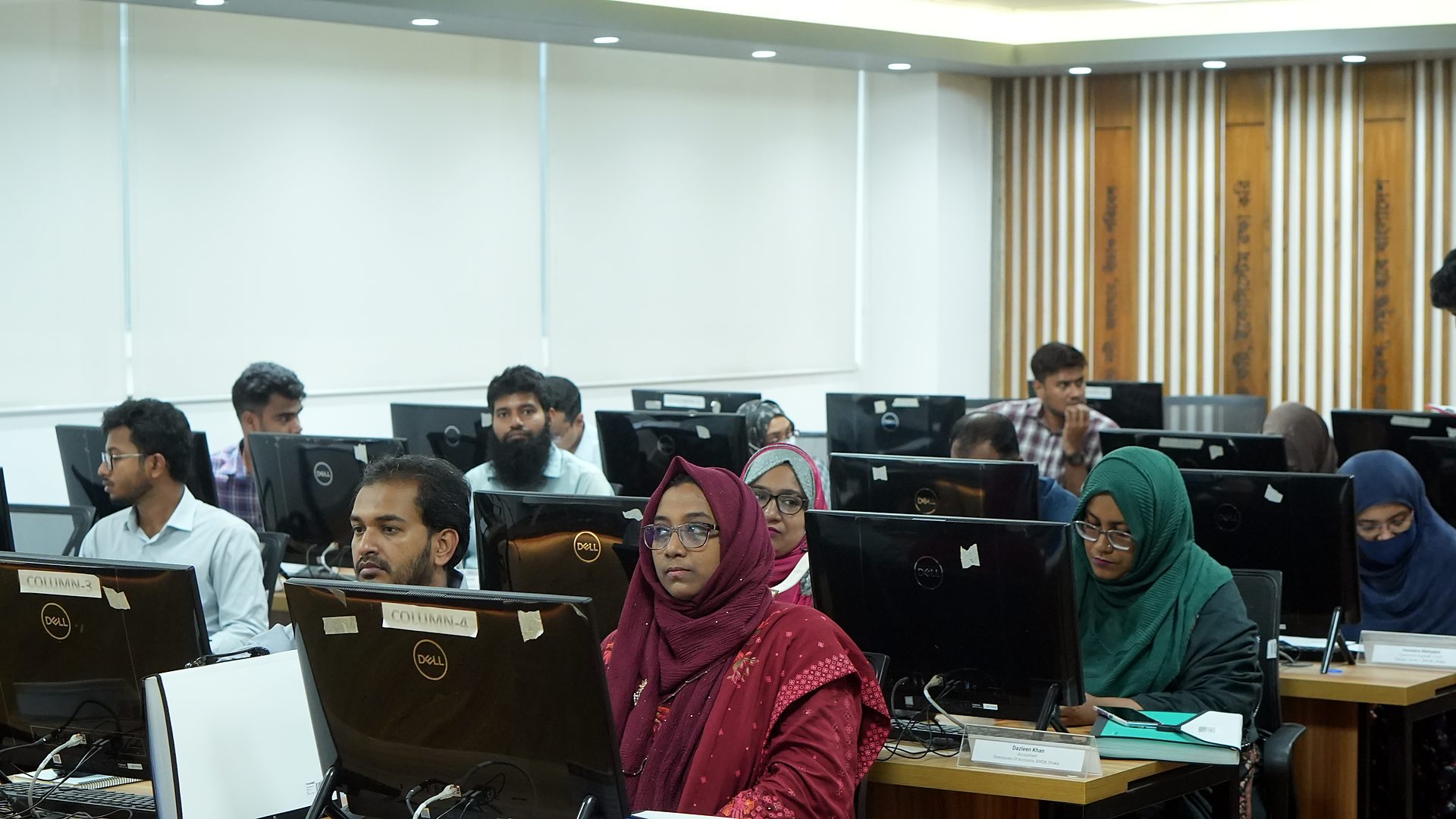 Participants seated by team on the opening morning