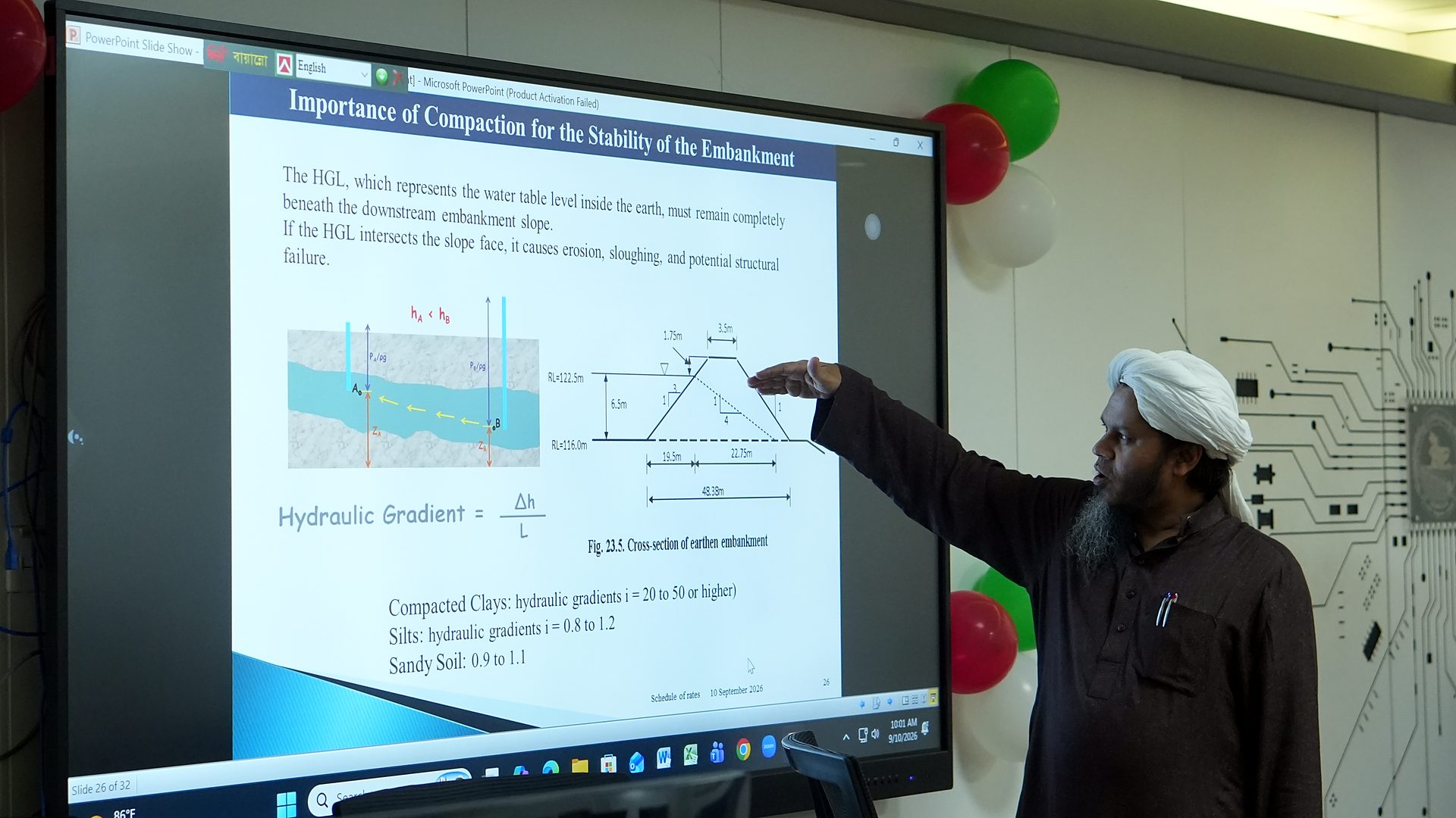 Slide on the importance of compaction for embankment stability, with the presenter pointing to the cross-section