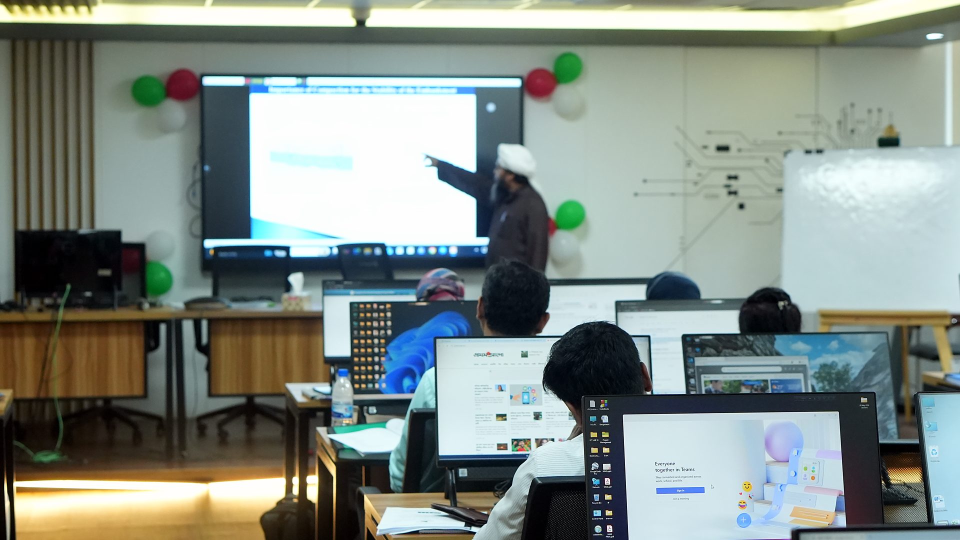 Resource person explaining a slide