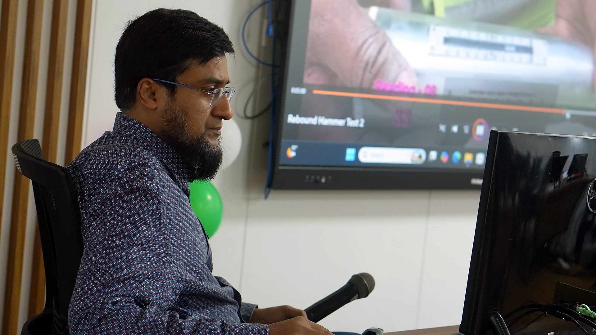 Participant watching a rebound hammer test video