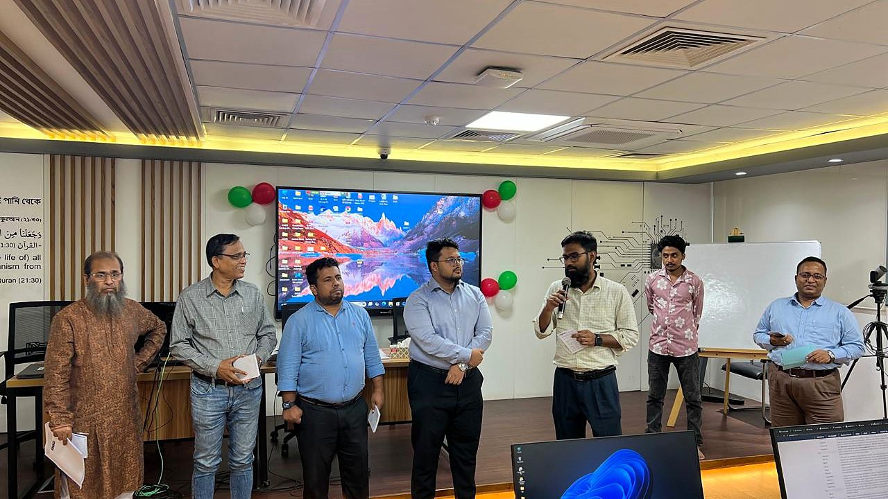 Participant group presenting at the front of the lab