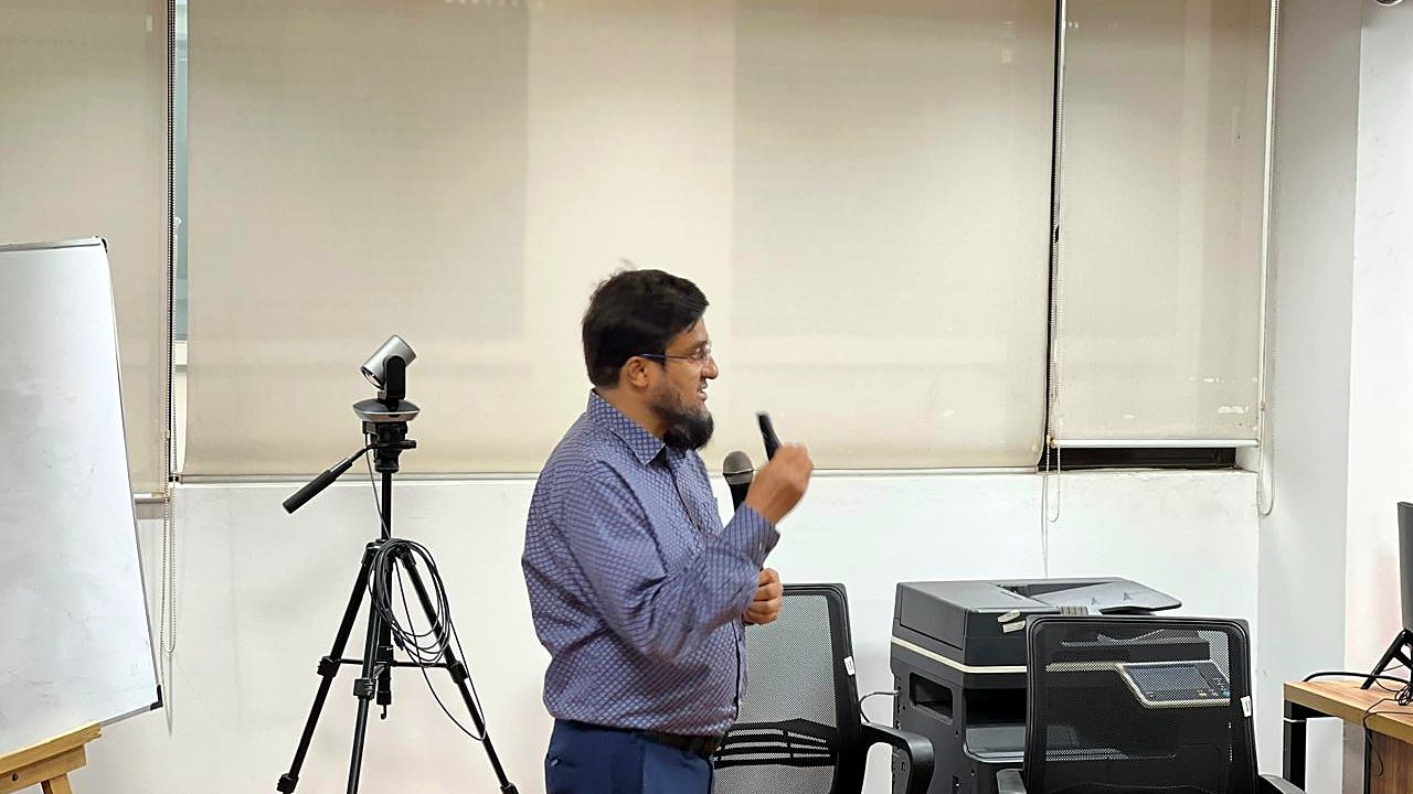Participant speaking with a microphone