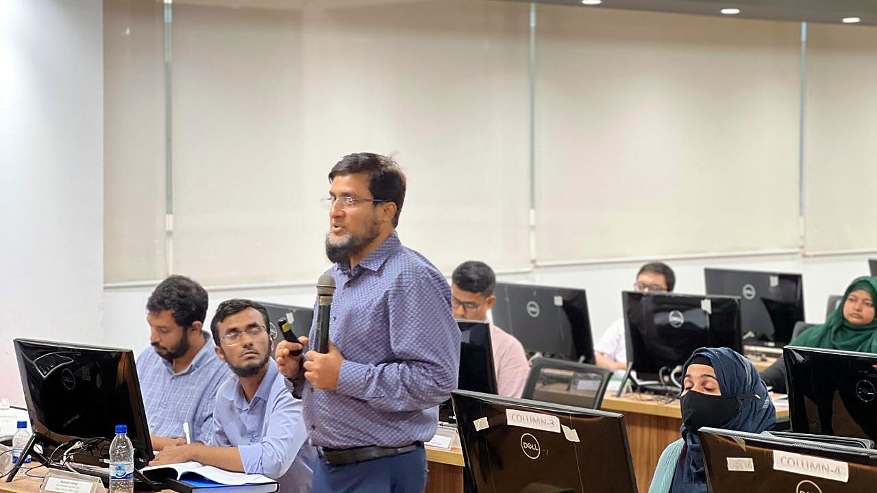 Participant standing to ask a question