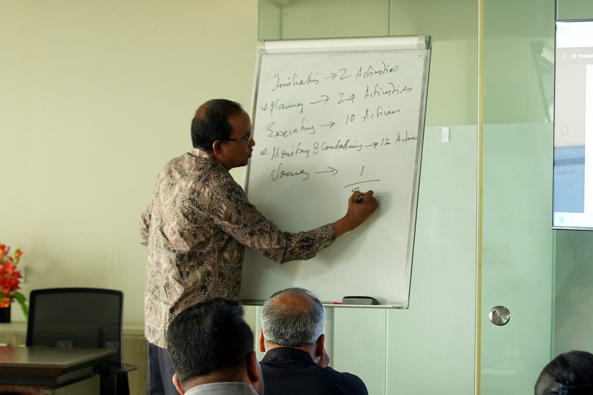 Trainer writing on the flipchart
