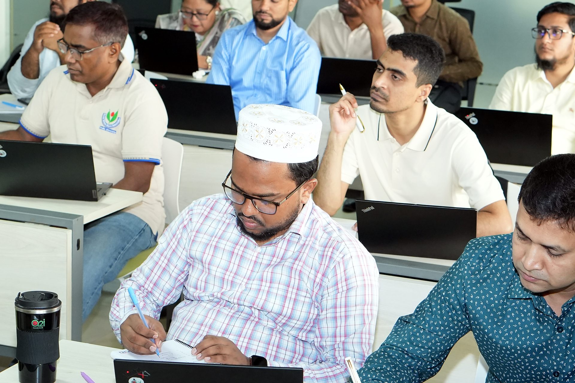 Participants taking notes