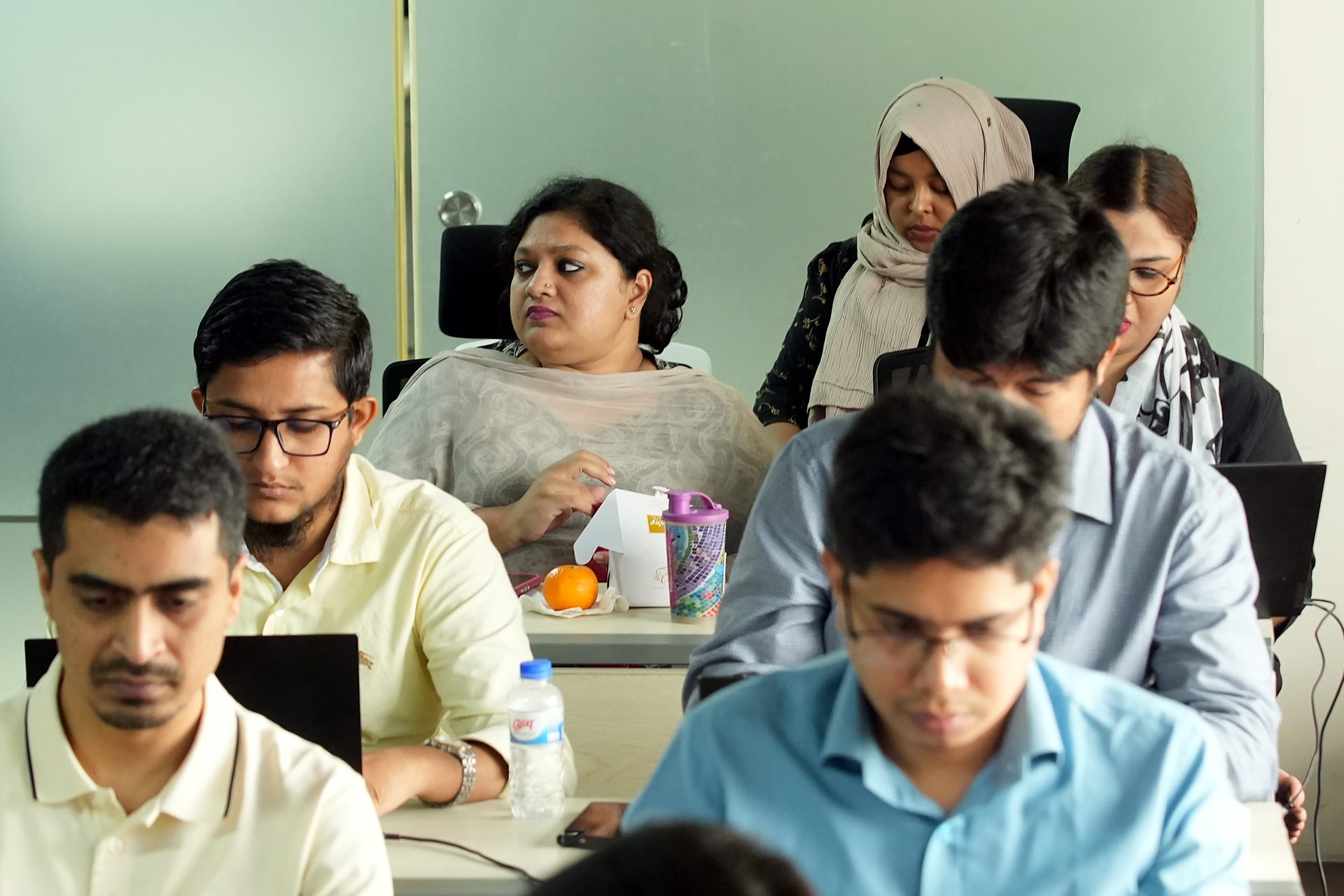 Participants taking notes during the session