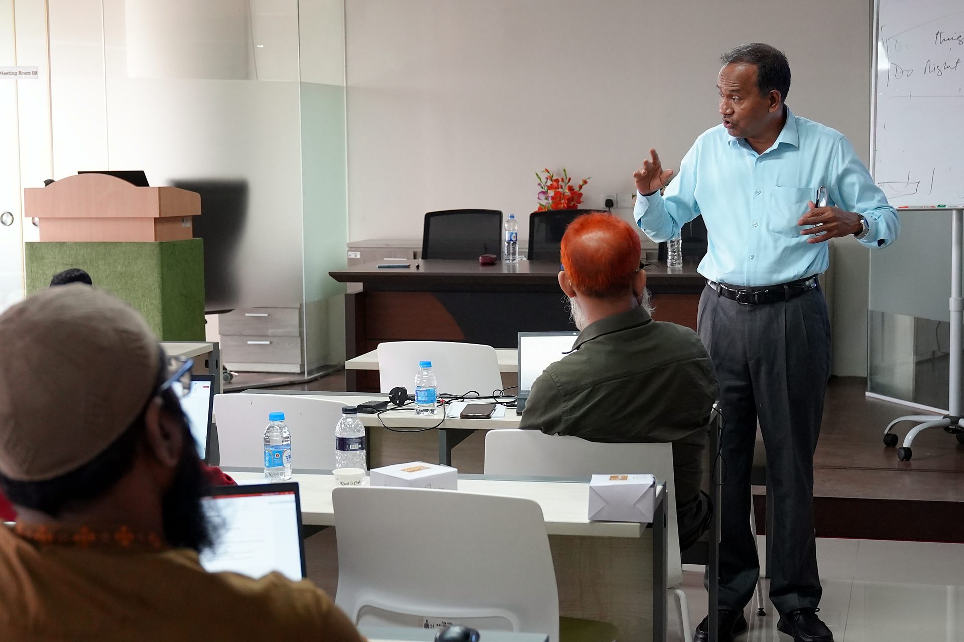 Trainer gesturing during an explanation