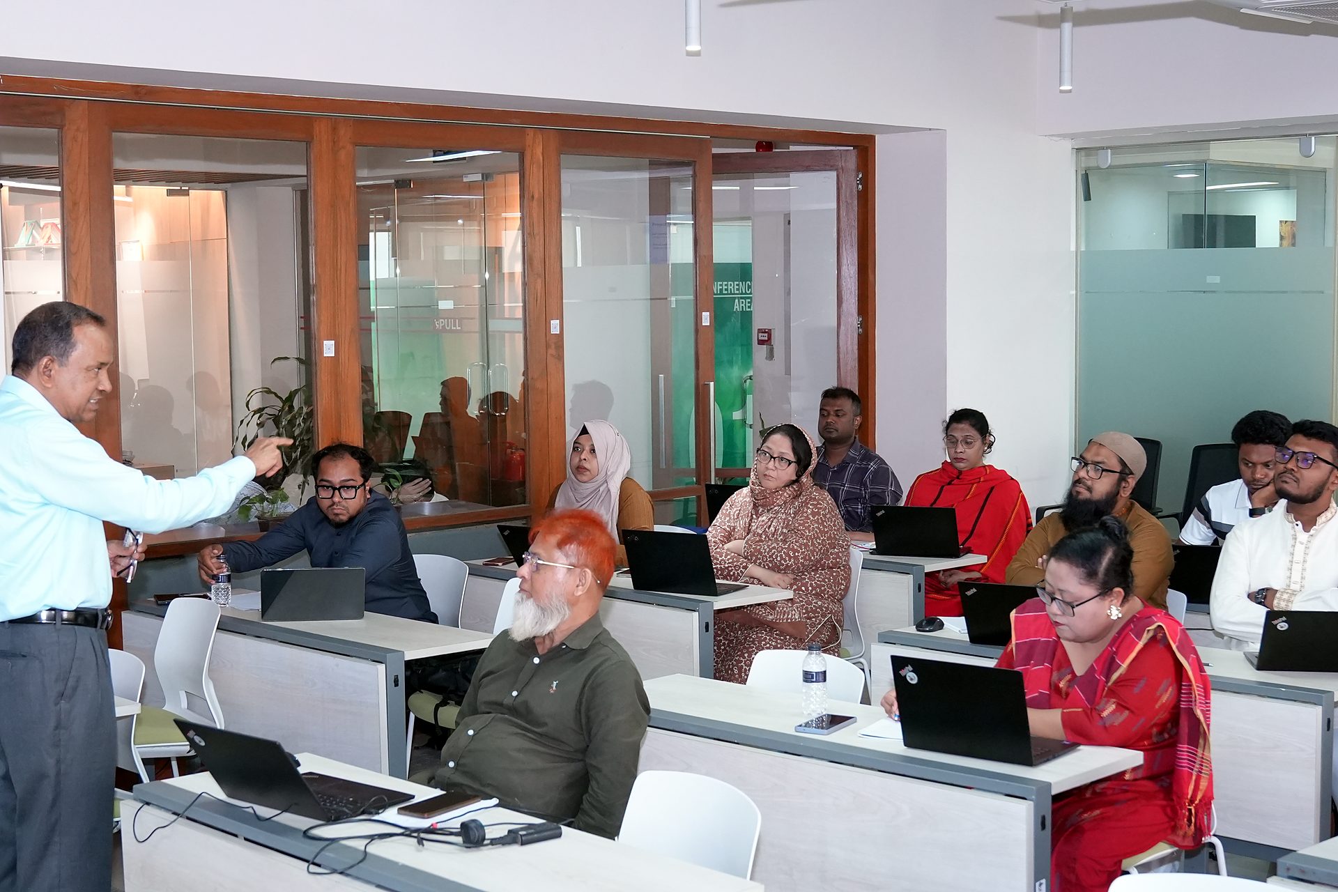 Trainer gesturing toward participants