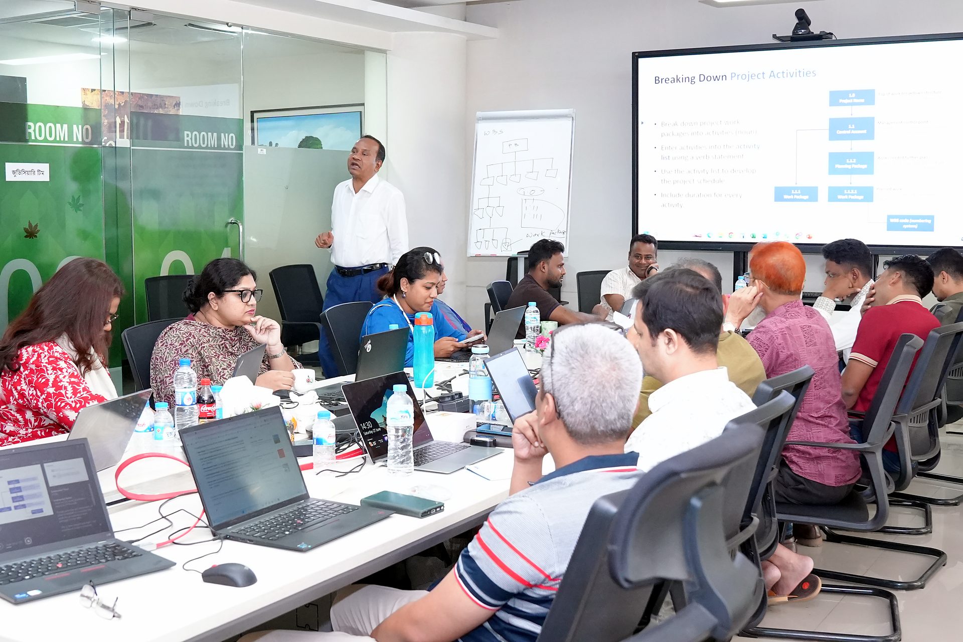 a2i officials at boardroom tables during the final day of the PMP programme