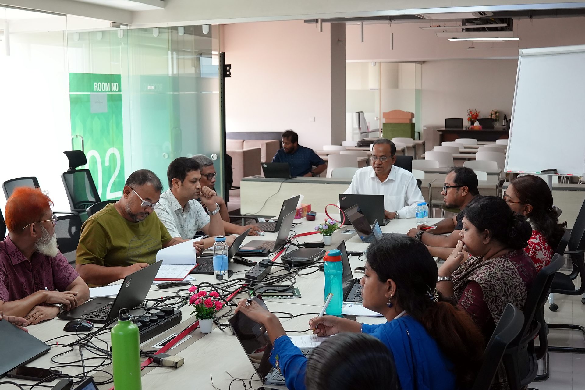 Participants at the boardroom table