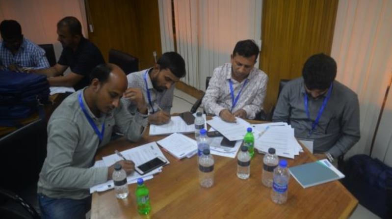 Participants engaging in a lecture session on financial management